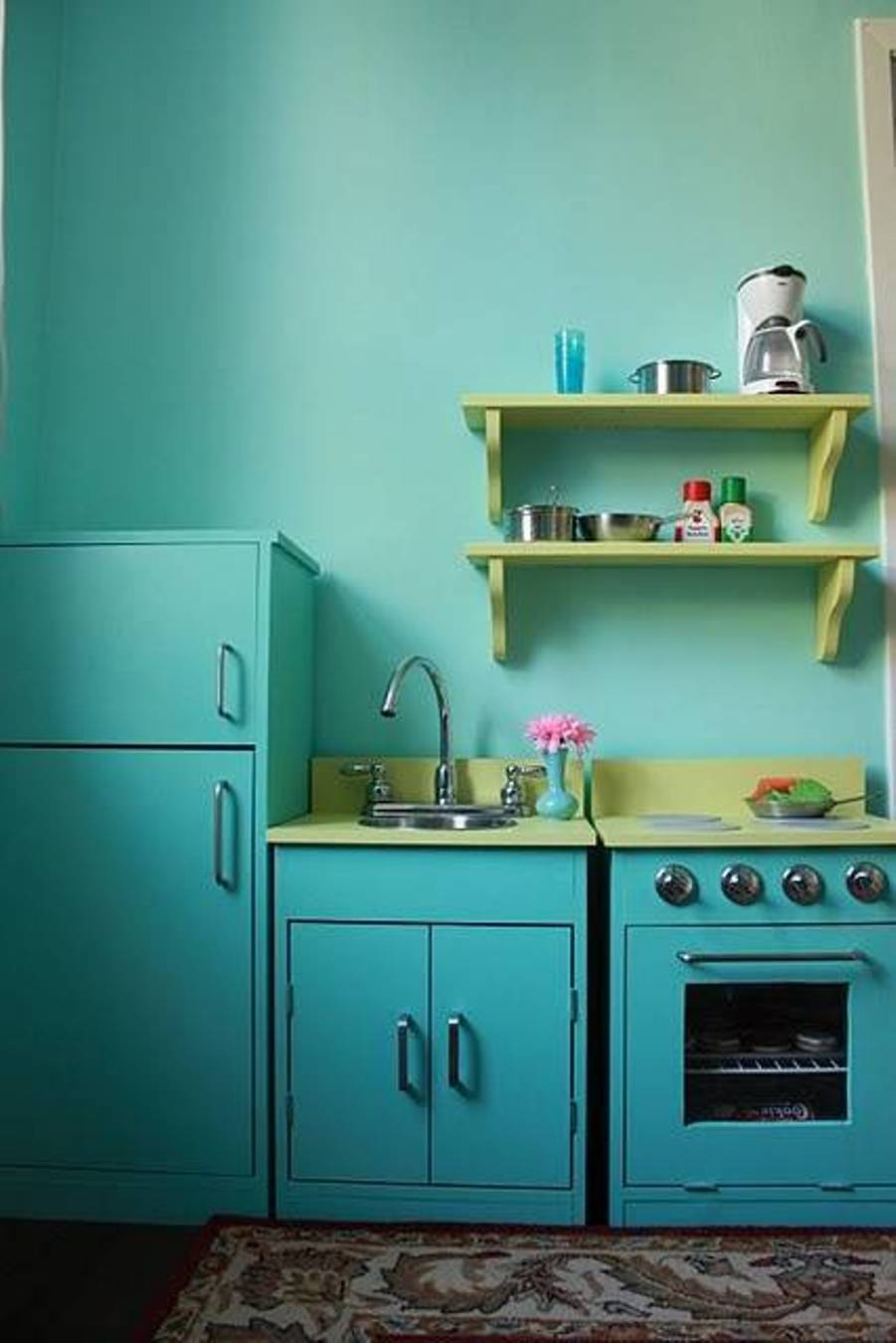 kitchen-turquoise-walls-with-green-open-shelving-and-free-standing-range-and-sink-and-pantry